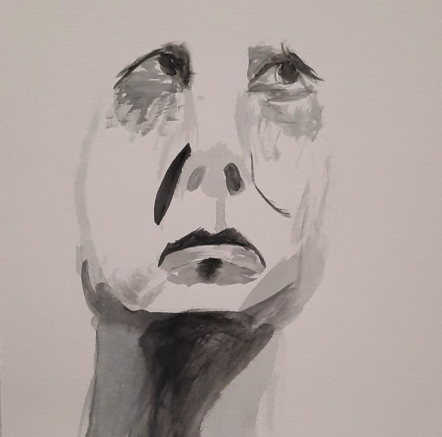 the face of a man looking forlorn